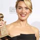 Kate Winslet holds up her award for Best Performance by an Actress In A Supporting Role in a Motion Picture for the film `The Reader`